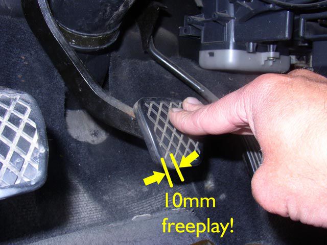 What is the brake pedal free play range permitted while adjusting?